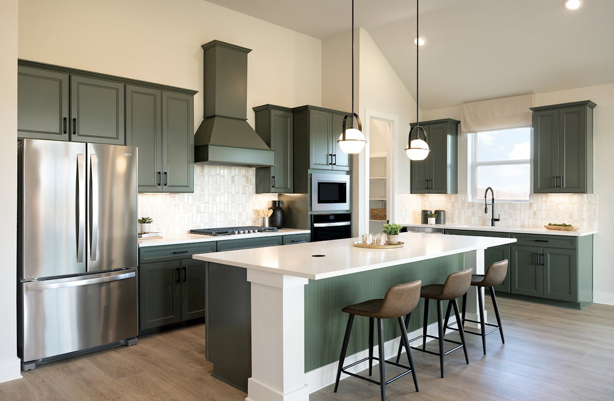 kitchen with white countertops & green cabinets