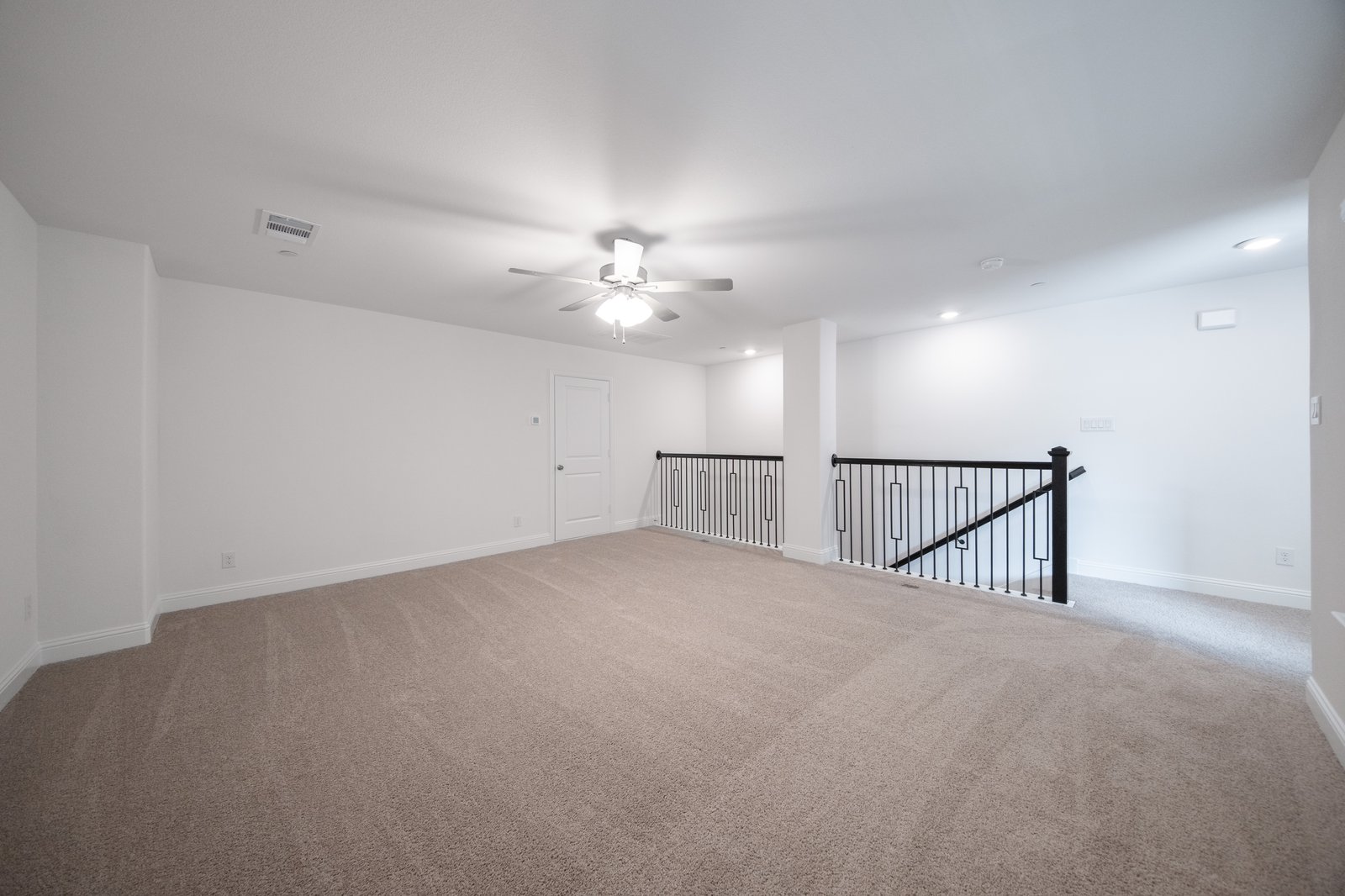 loft with carpet and ceiling fan