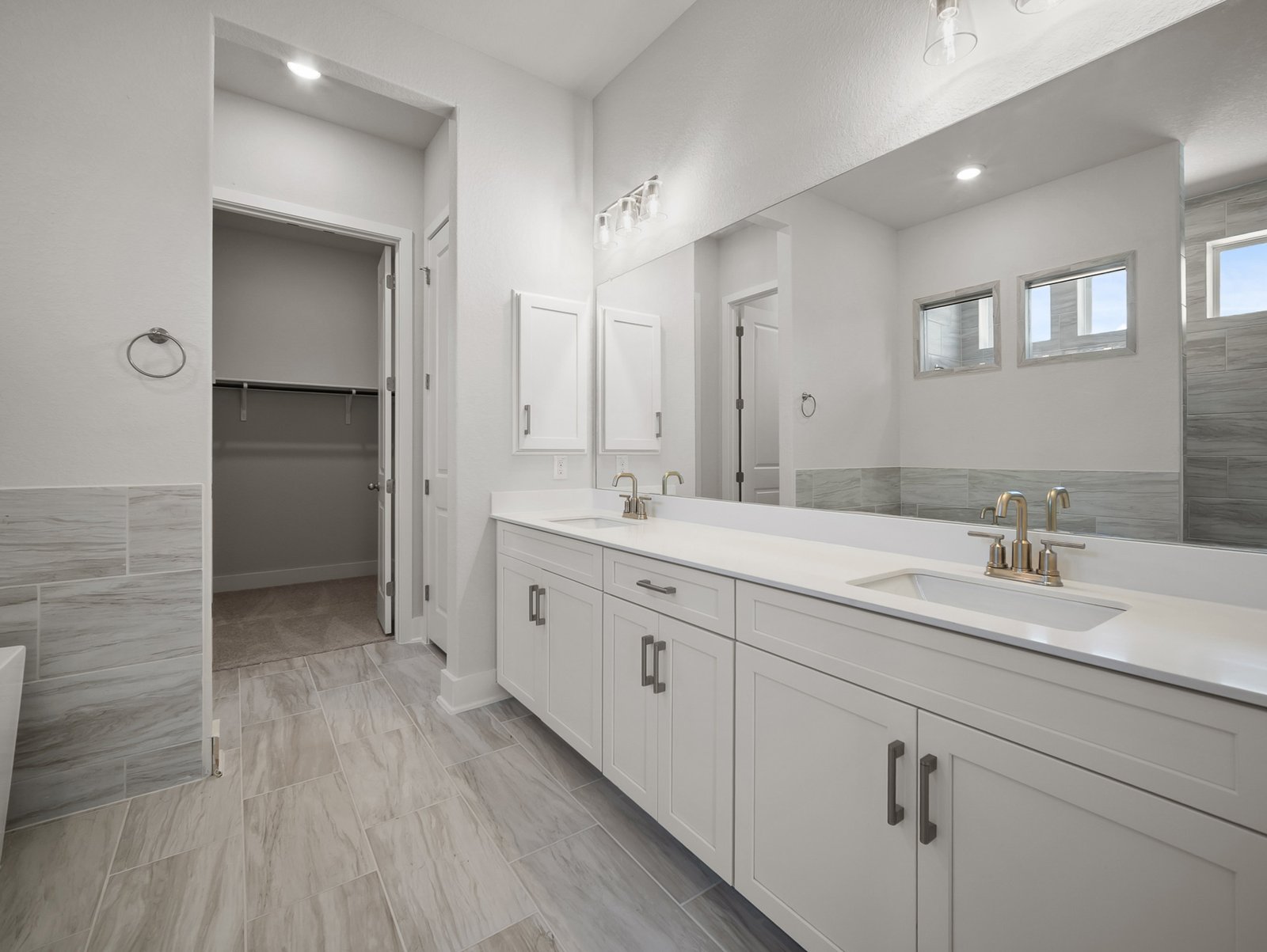 bathroom with soaking tub, walk-in shower & dual sinks