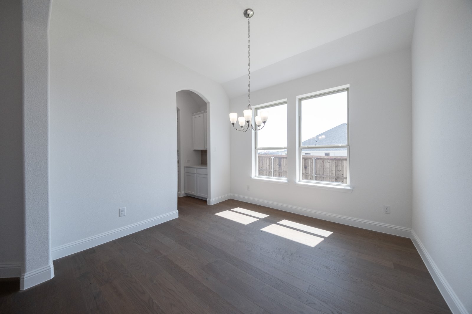 open dining room with hardwood flooring
