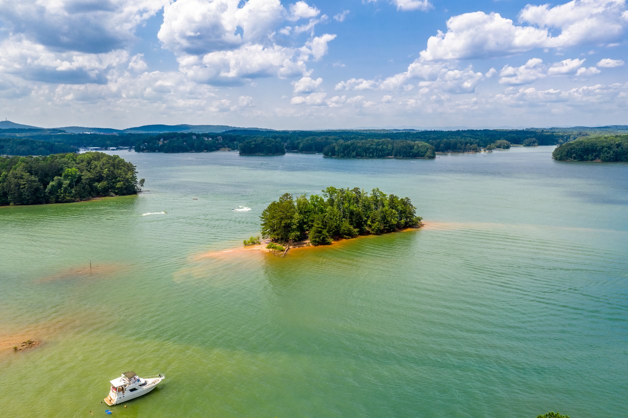 aerial view of lake with boat 