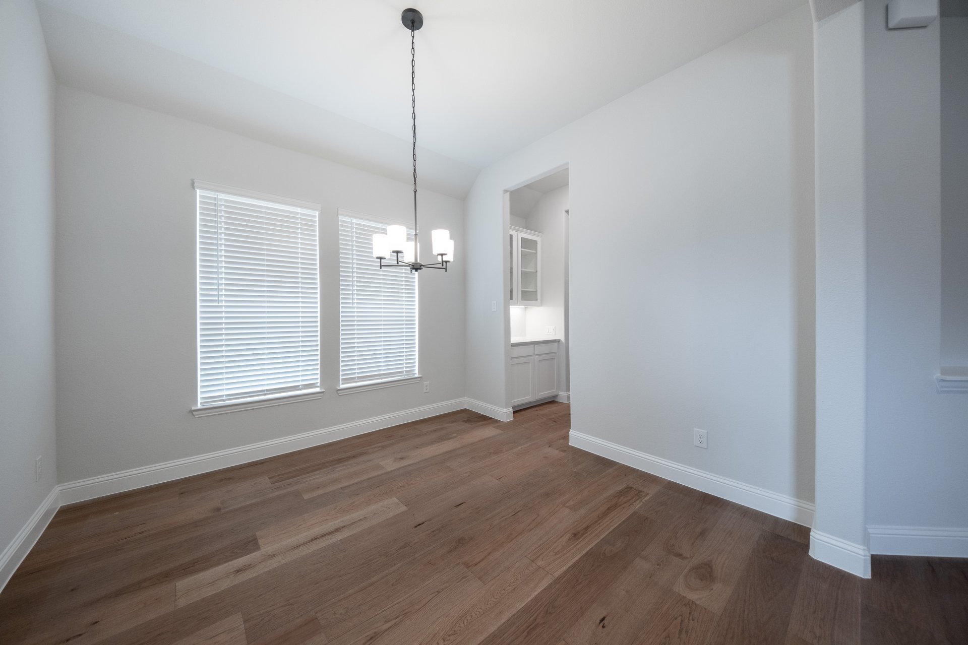 open dining room with hardwood flooring