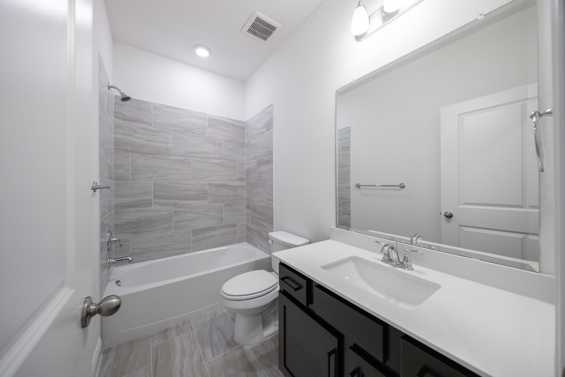 bathroom with tub and tile 