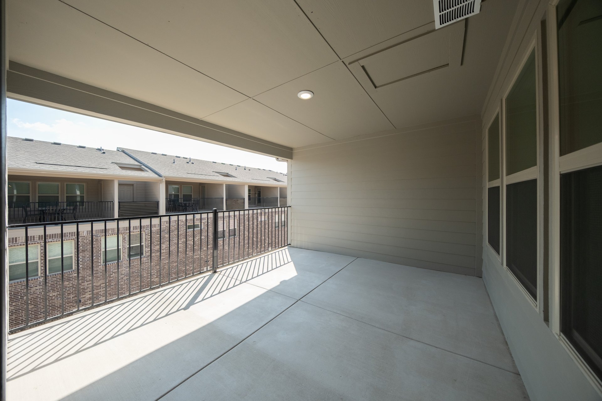 terrace with windows and iron railing 