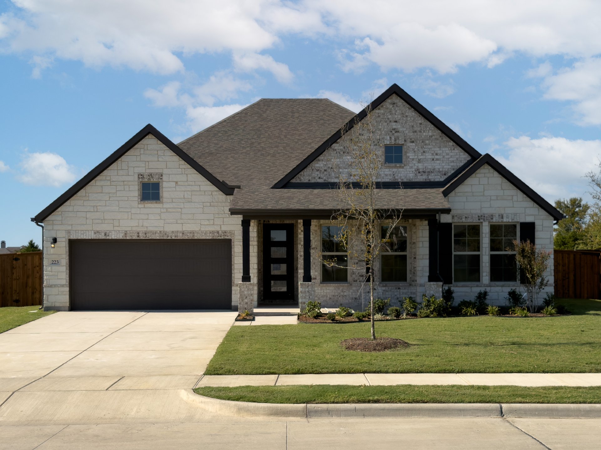 one-story home with brick and stone exterior