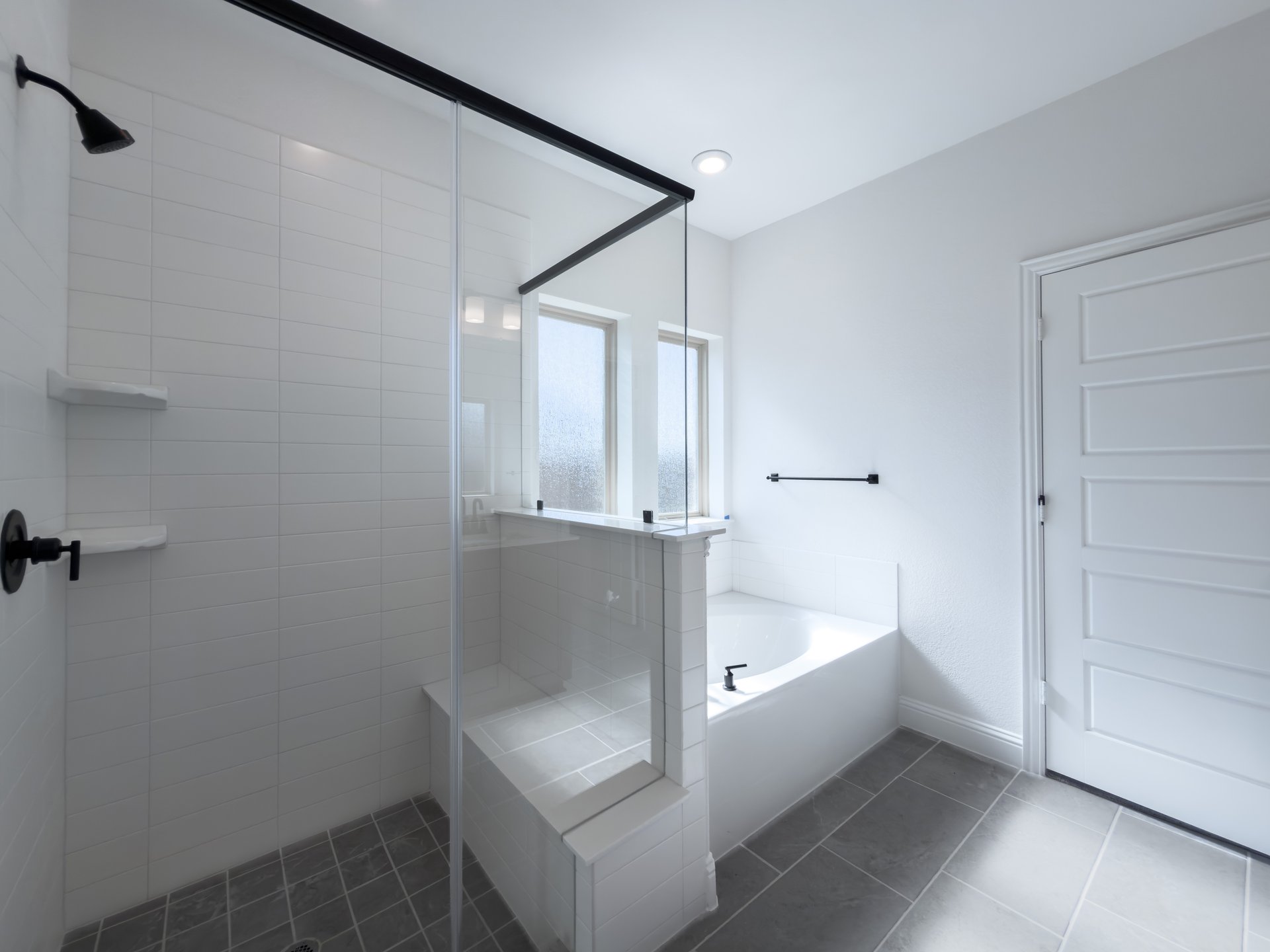 primary bathroom with walk-in shower and soaking tub
