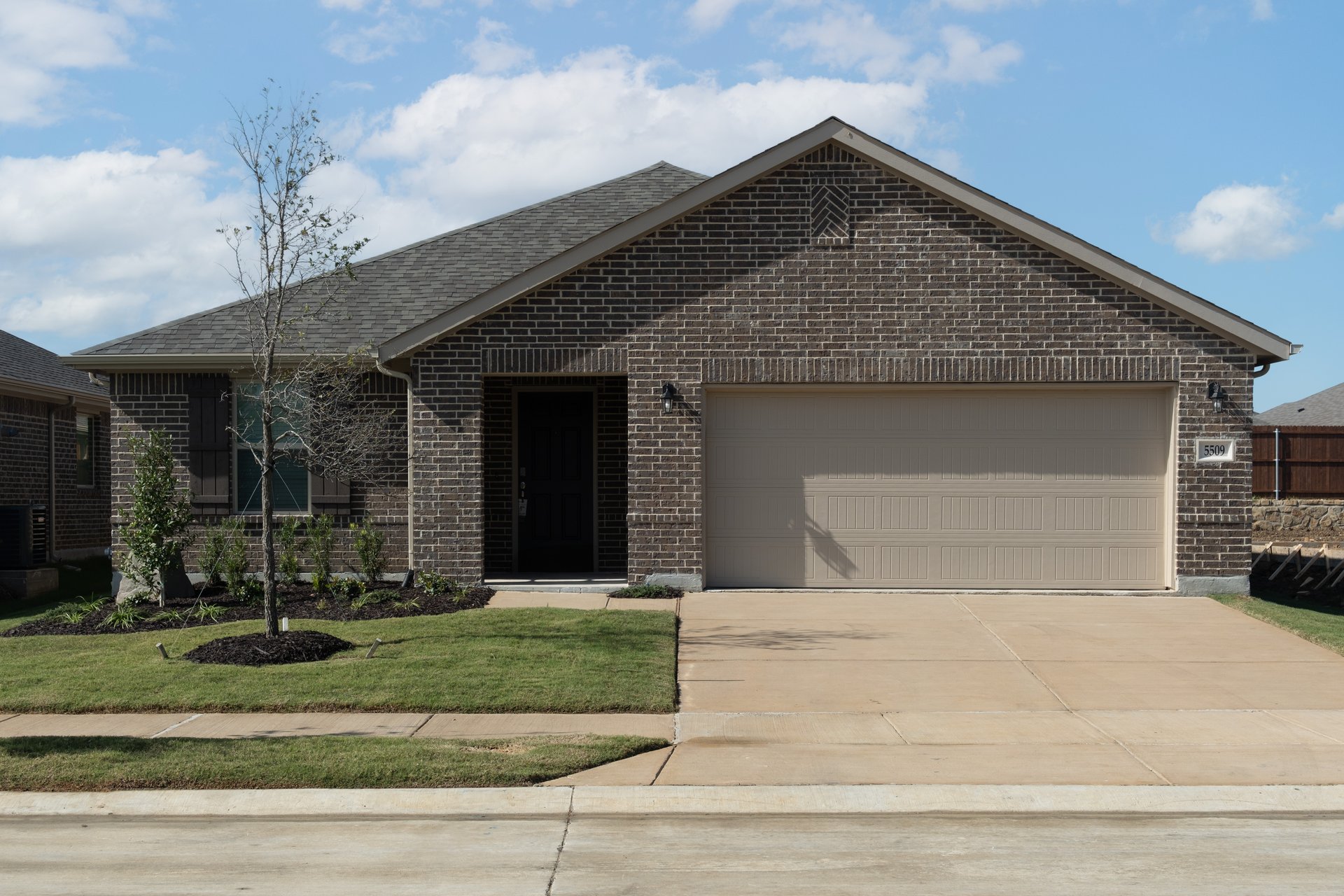 exterior of home with dark brown brick