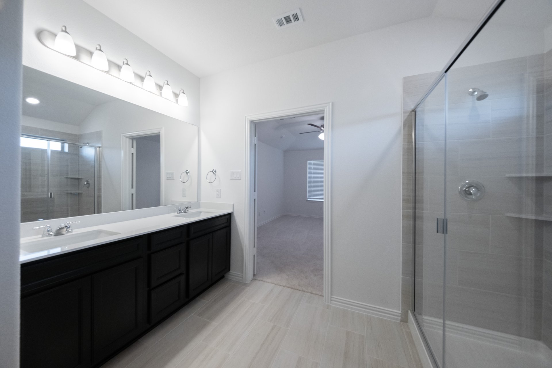 primary bathroom with separate soaking tub and walk-in shower