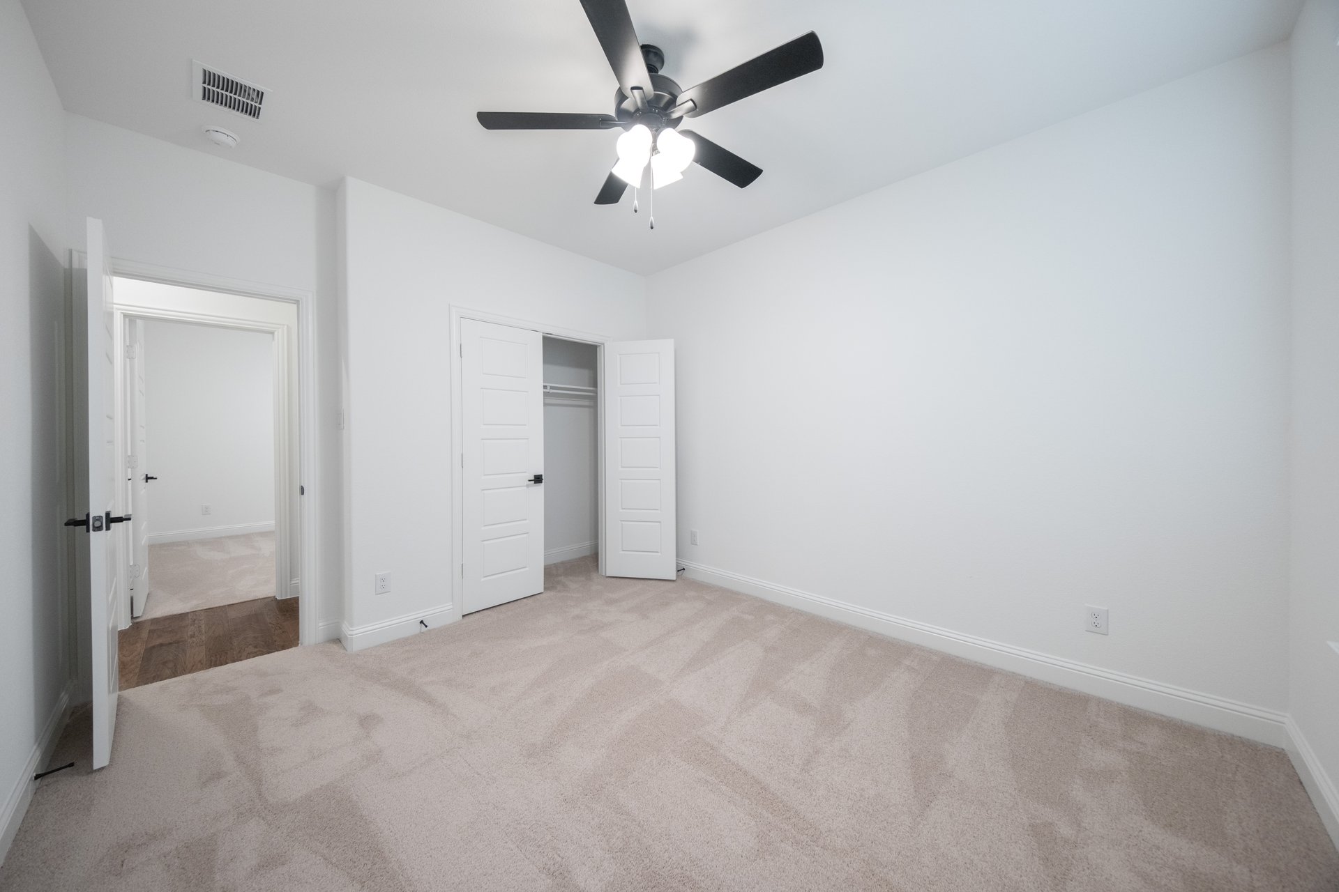 guest bedroom with carpet and walk-in shower