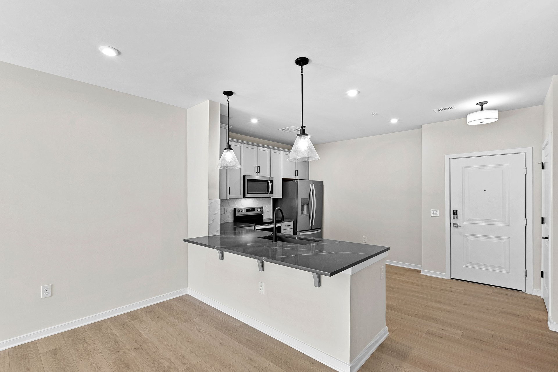 kitchen with quartz countertops and white cabinets