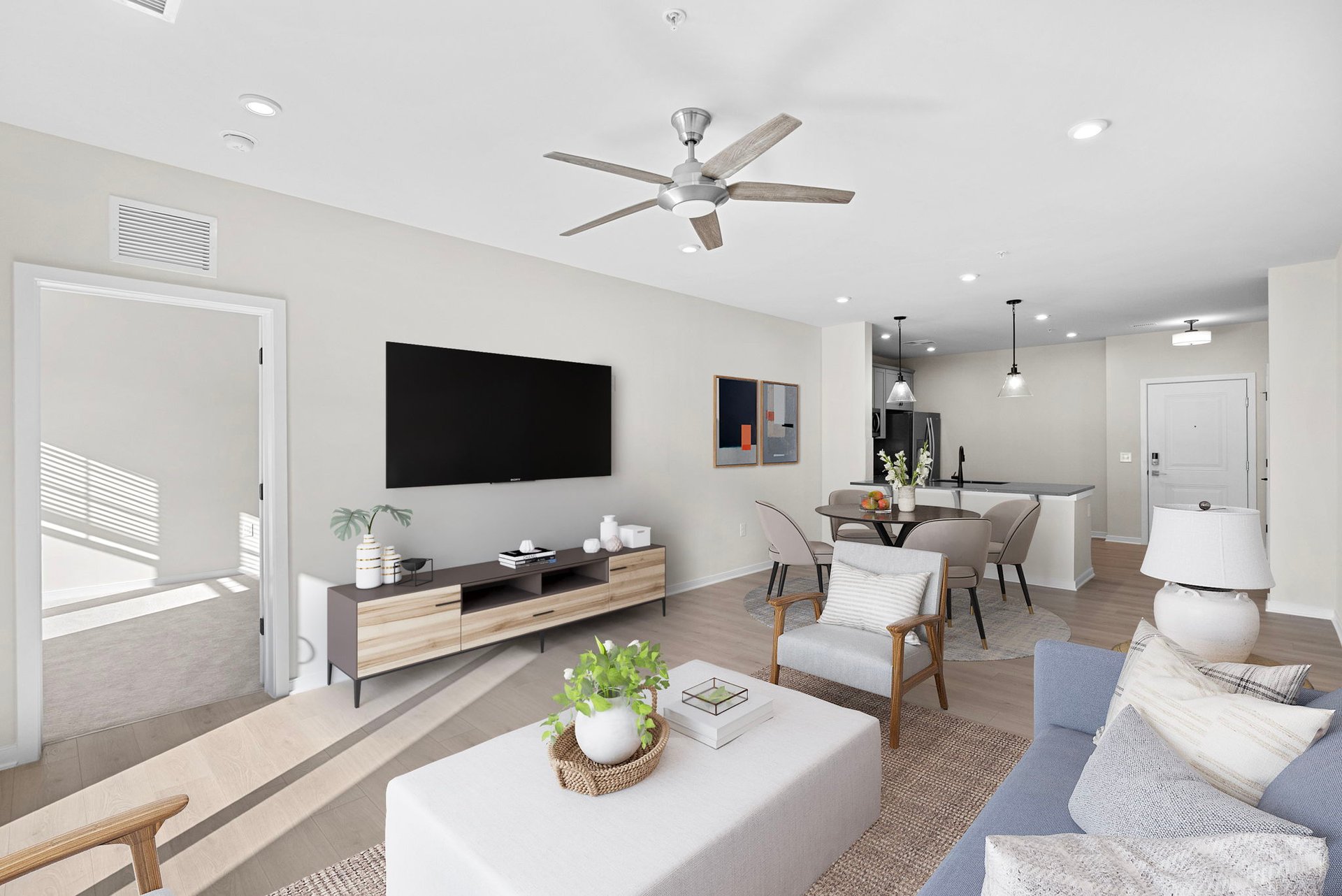 living room with sofa, coffee table, and chairs