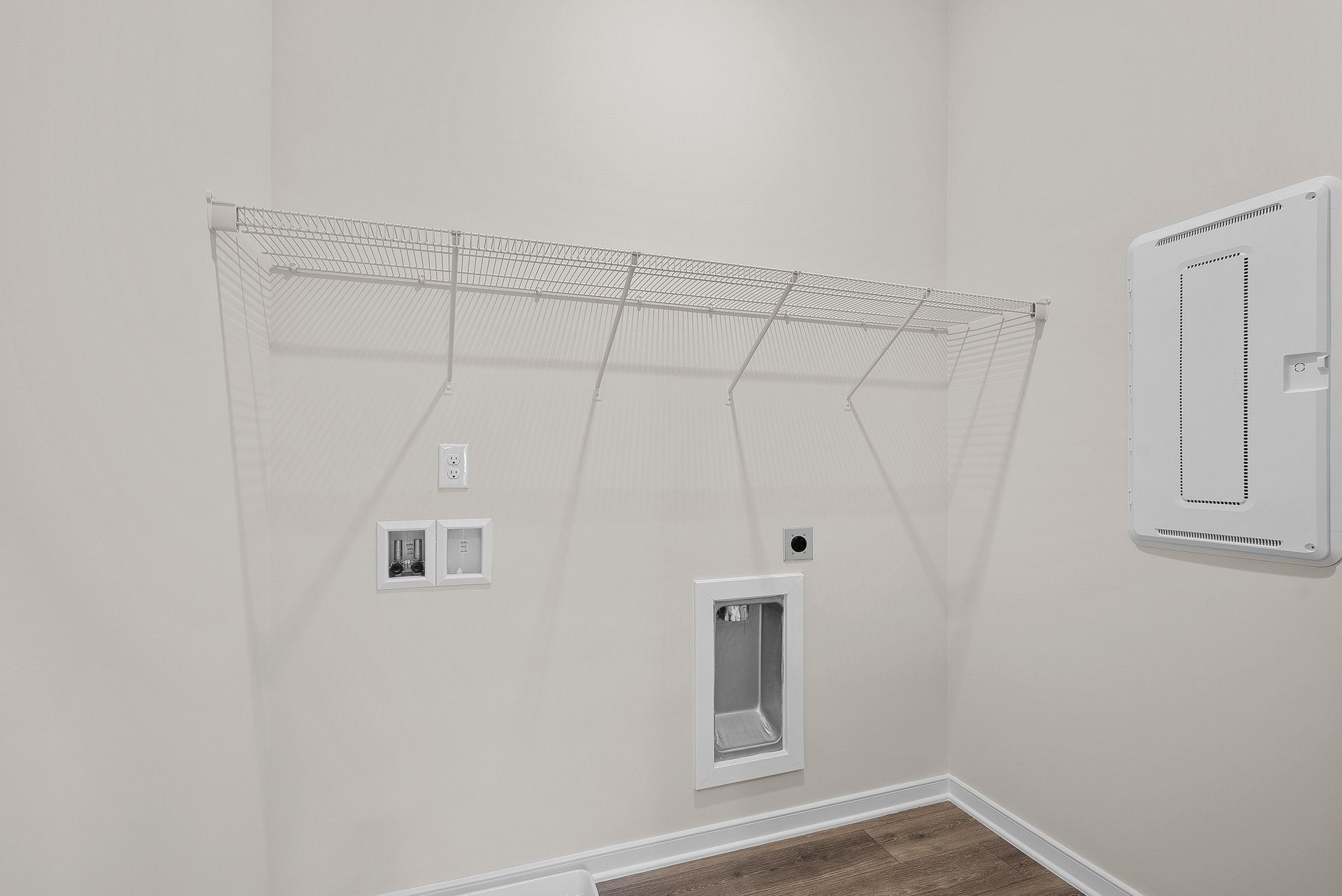 laundry room with voltage panel
