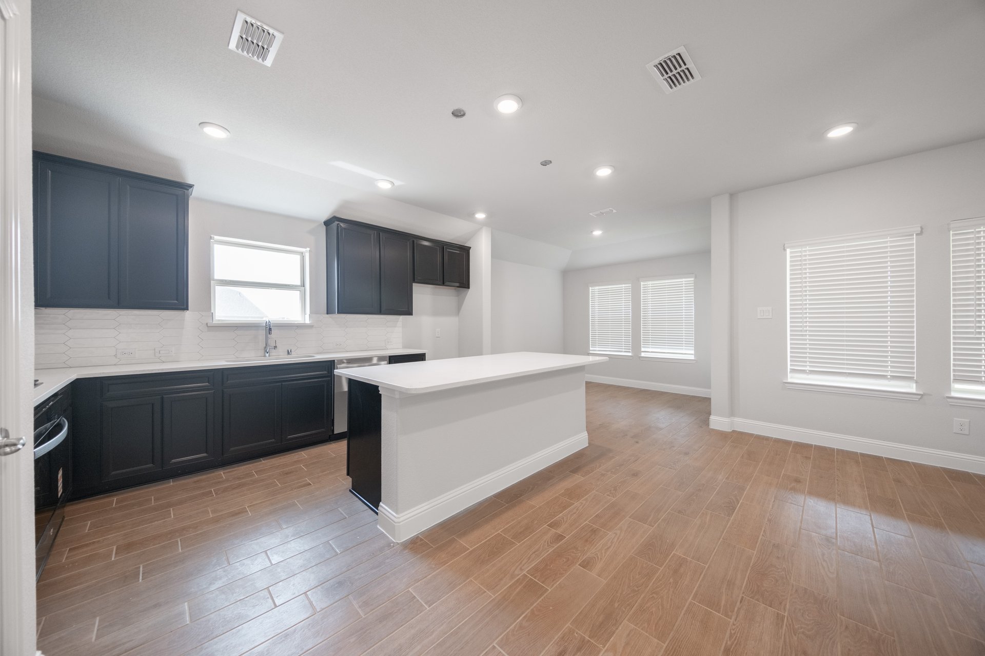 kitchen with large island and white countertops 
