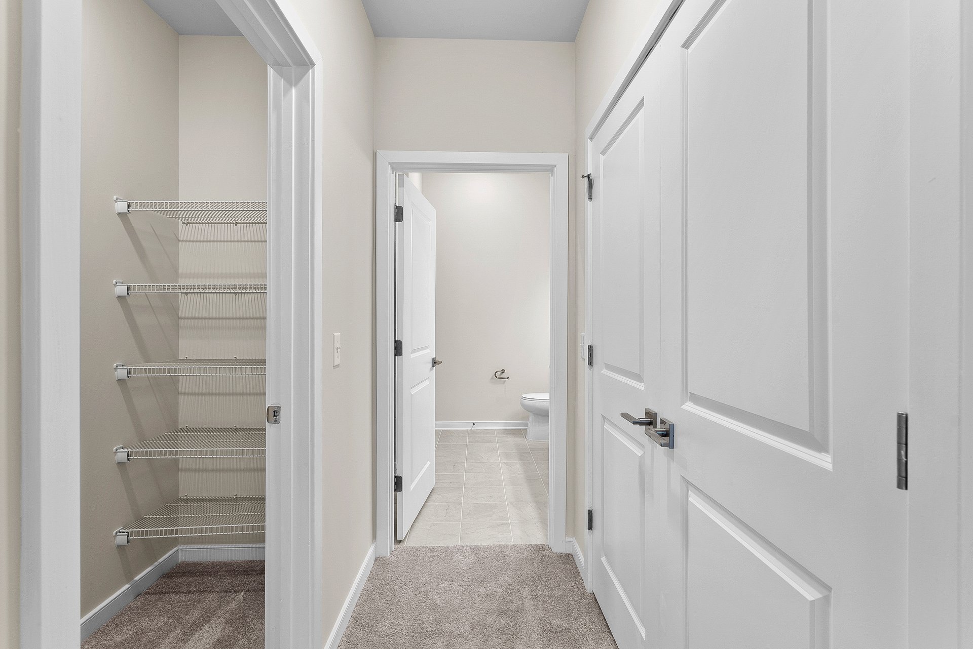 primary bedroom hallway to bathroom and closets