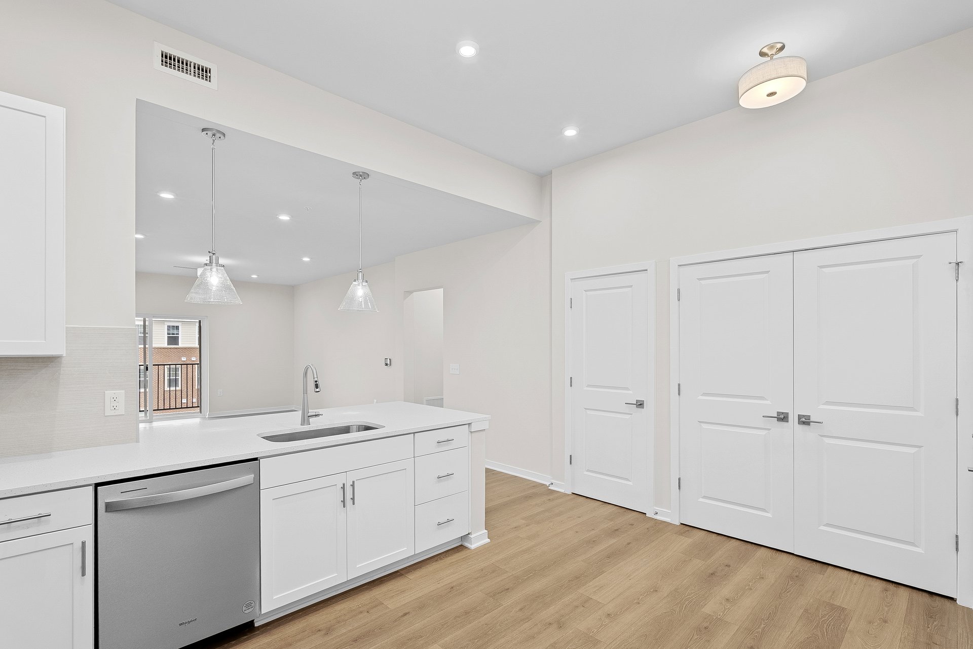 kitchen with quartz countertops and white cabinets