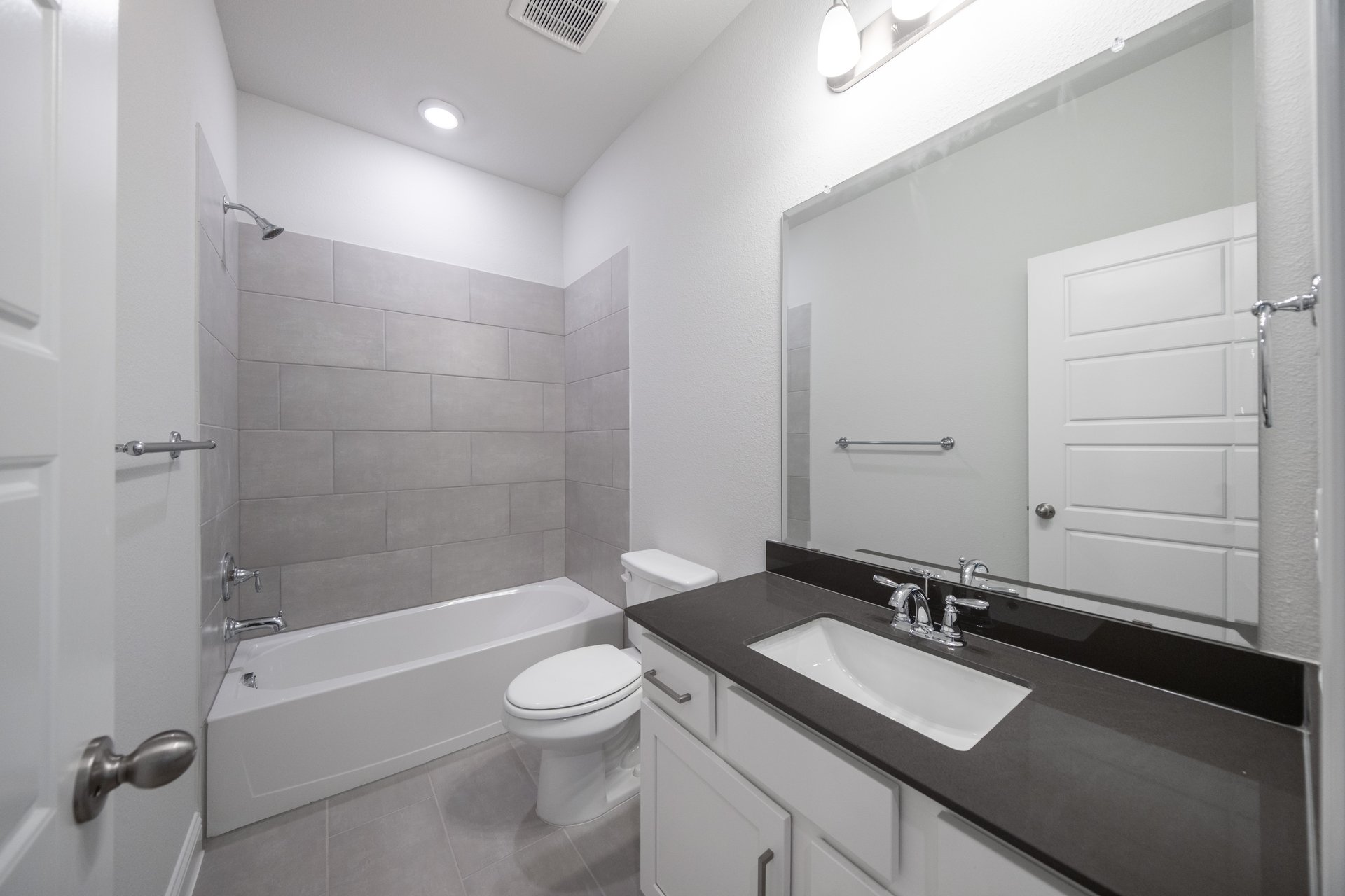 bathroom with tub and tile 