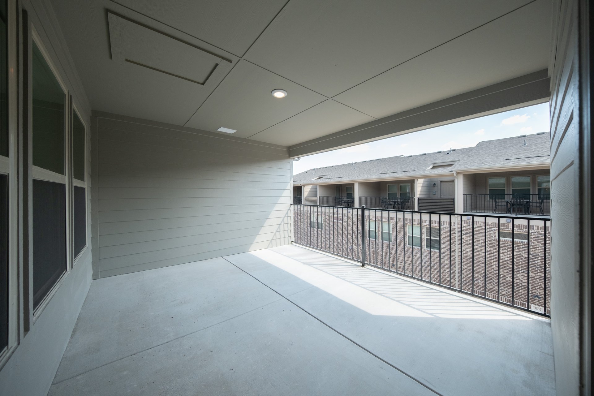 terrace with windows and iron railing 