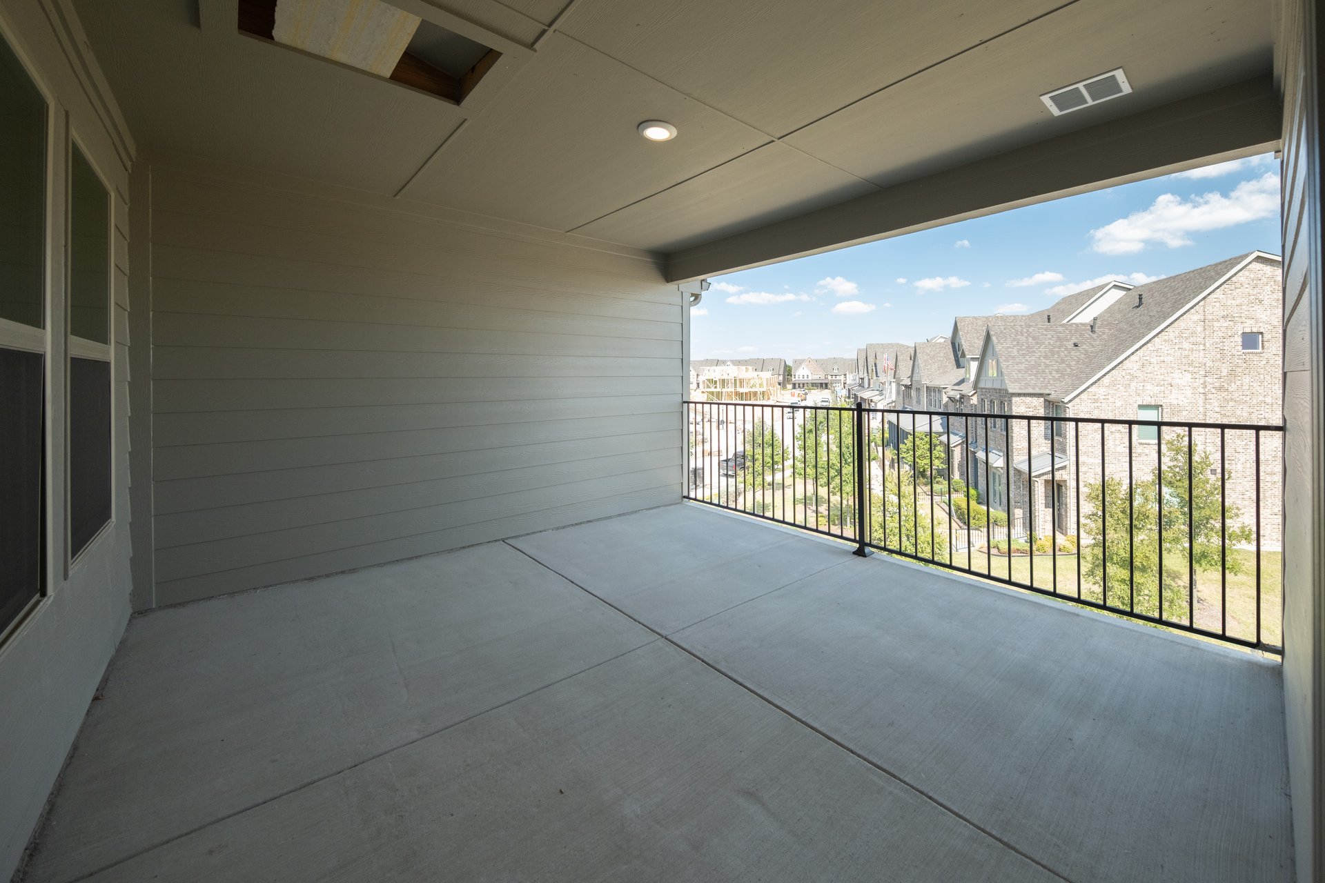 third-floor terrace with iron railing