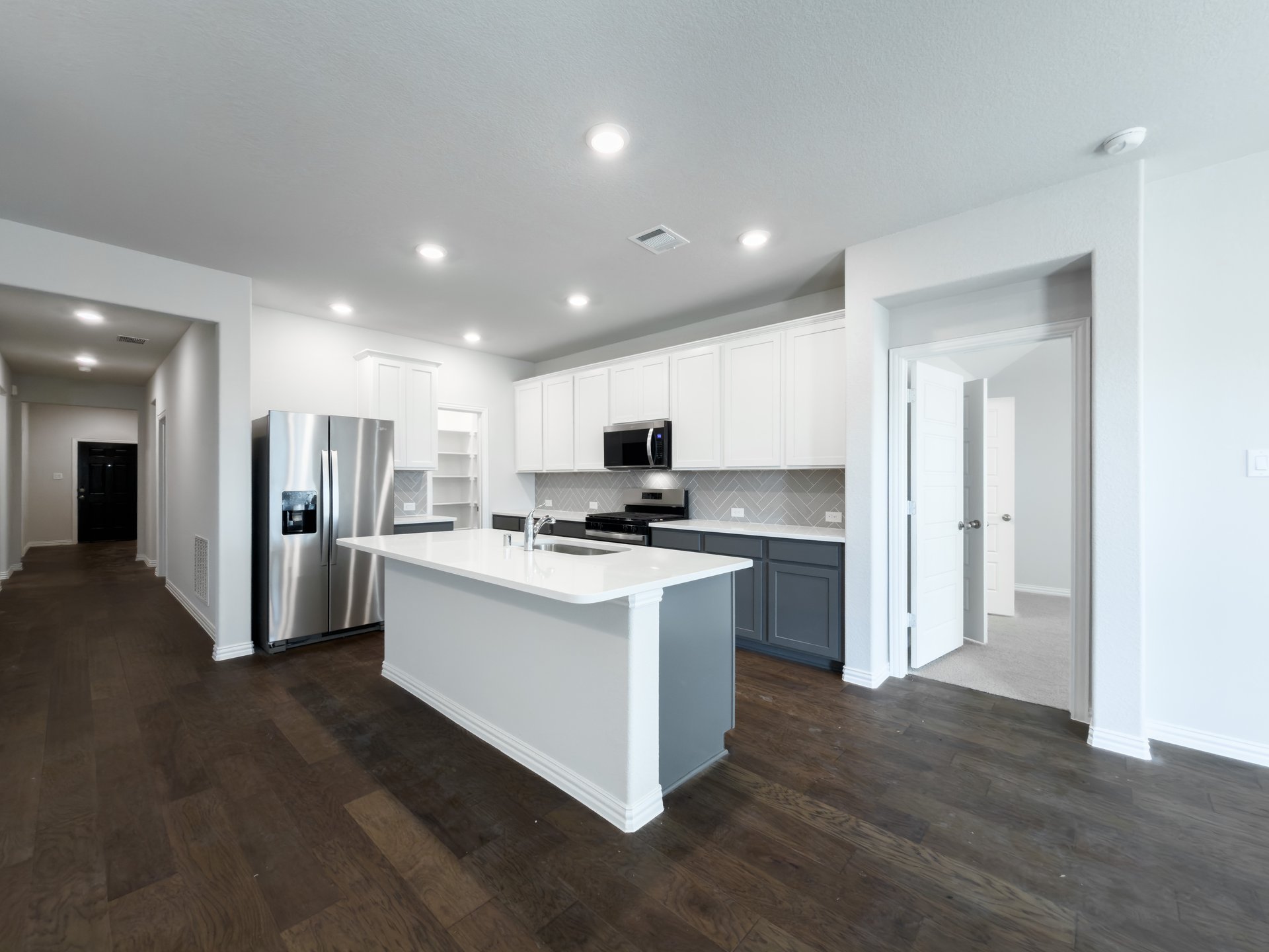 kitchen with white cabinets and countertops