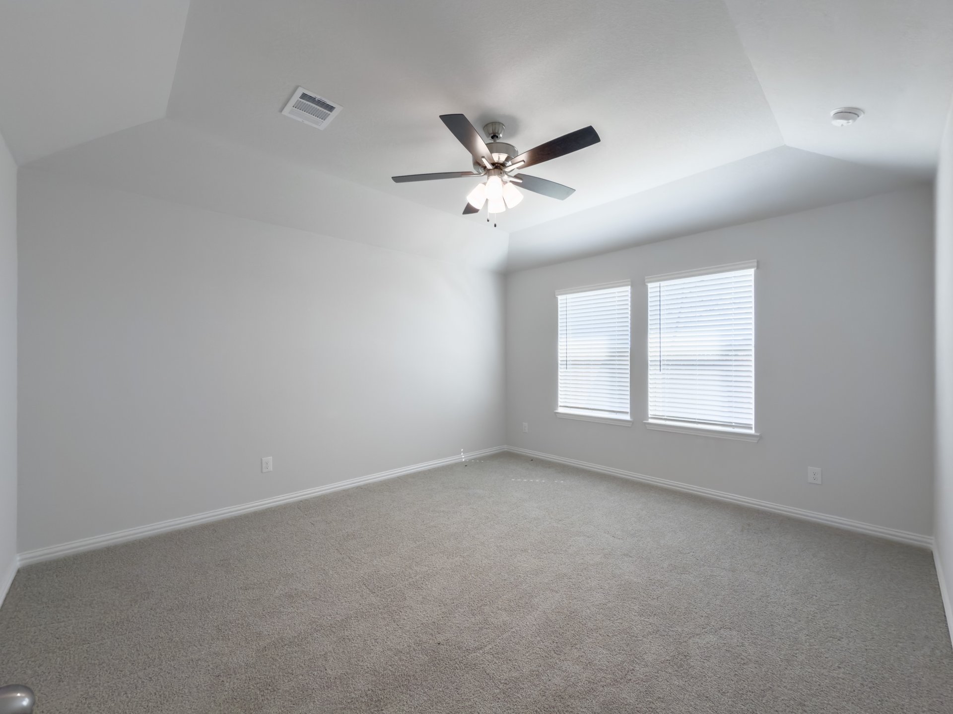 bedroom with carpet and ceiling fan 