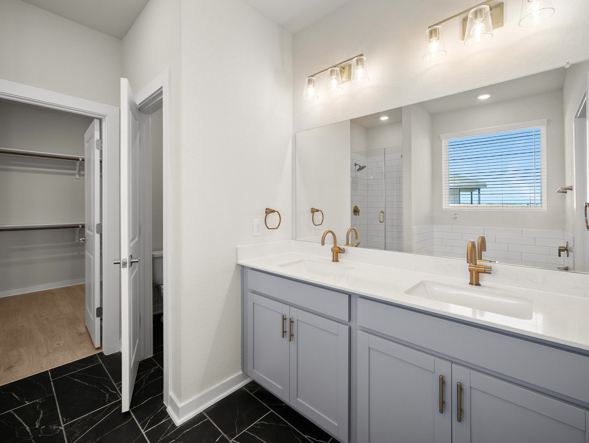 bathroom with soaking tub, walk-in shower & dual sinks