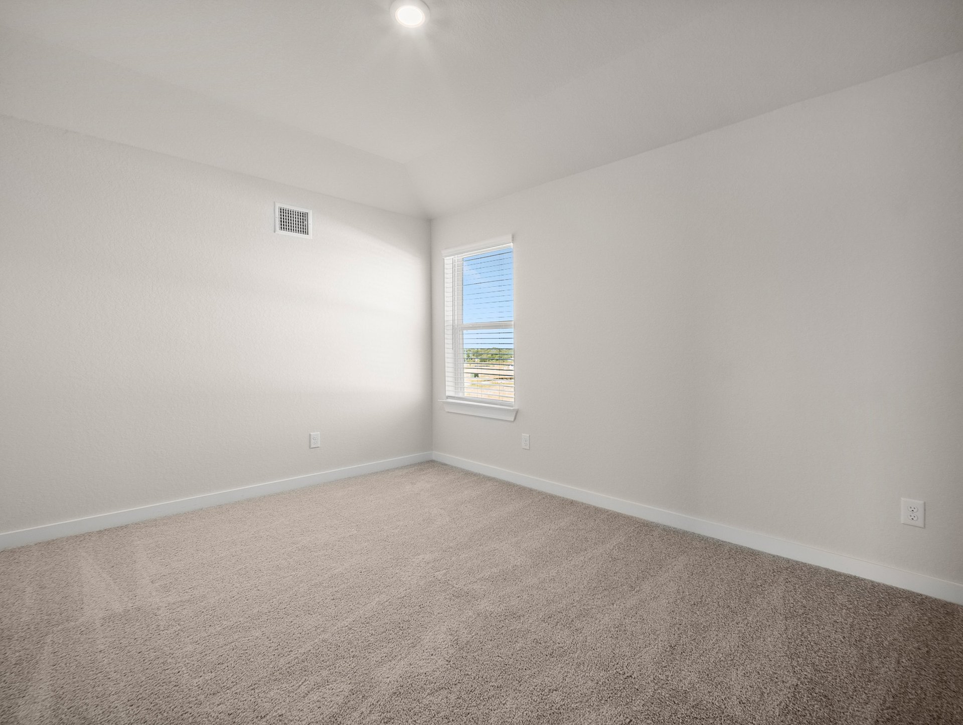 bedroom with a window, carpet & sloped ceiling