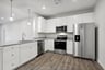 kitchen with quartz countertops and stainless steel appliances