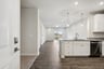 kitchen with quartz countertops and pendant lighting