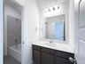guest bathroom with soaking tub