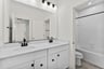 secondary bathroom with a tub/shower combo