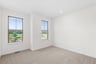 secondary bedroom with two doors to closet and hallway
