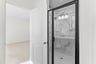 primary bathroom with an oversized shower