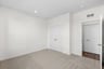 secondary bedroom with closet with two doors and door opening to hallway