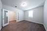 spacious study with hardwood flooring