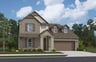 brick exterior with porch, grass & a tree