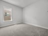 bedroom with carpet, windows & recessed lighting