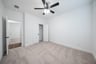 guest bedroom with carpet and walk-in shower