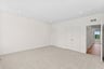 secondary bedroom with doors to closet and hallway
