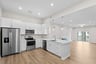 kitchen with quartz countertops and white cabinets