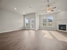 dining area with brown flooring, windows & recessed lighting