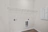 laundry room with voltage panel