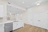 kitchen with quartz countertops and white cabinets