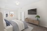 primary bedroom with queen bed and tv