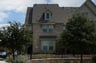 townhome exterior with brick and landscaping 