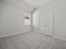bedroom with carpet, a window & a closet