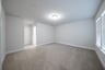 guest bedroom with carpet and attached bathroom