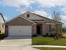 home exterior with brick and landscaping 