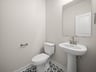 powder room with toilet & sink
