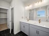 bathroom with soaking tub, walk-in shower & dual sinks