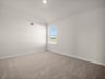 bedroom with a window, carpet & sloped ceiling